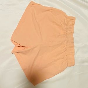 Peach, size extra small shorts.